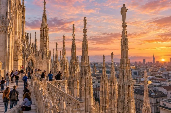 Visitors on the Duomo terraces among marble pinnacles at sunset