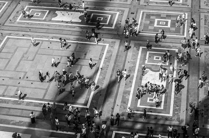 Piazza del Duomo seen from the rooftop, with tiny people on the paving